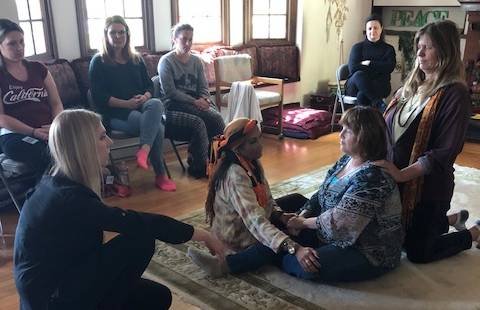 Megan Gunsorek facilitating a Family Constellations workshop with participants in a group circle